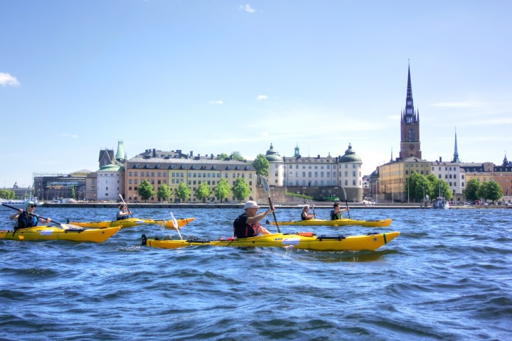 a small yellow boat on a body of water