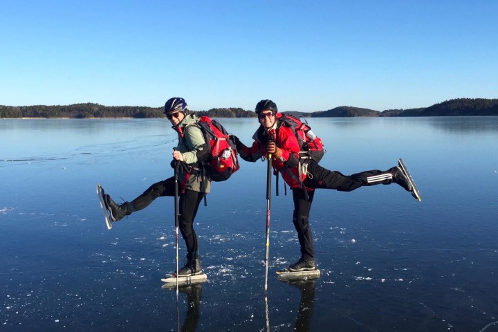 two persons ice skating on natural ice