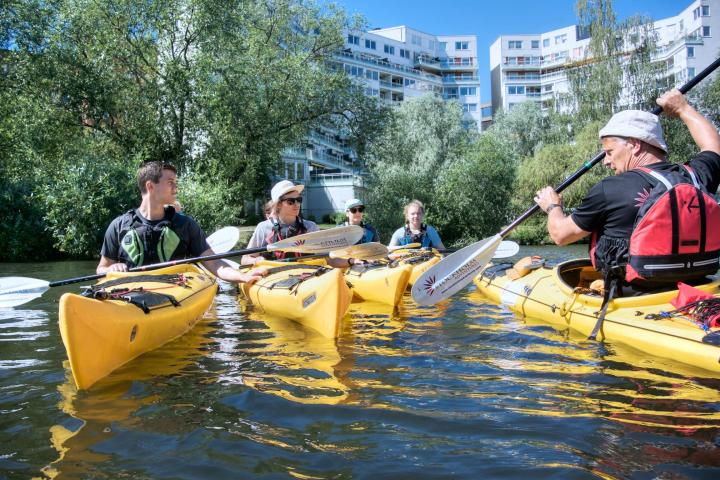 a group of people riding on the back of a boat