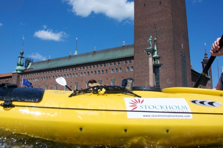 a person riding on the back of a boat